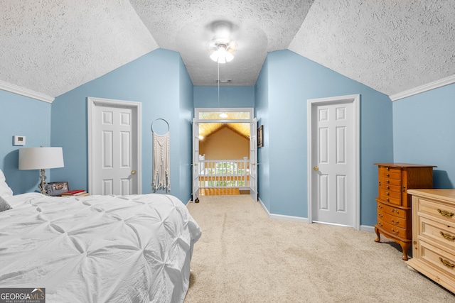 bedroom featuring lofted ceiling, ceiling fan, light colored carpet, and a textured ceiling