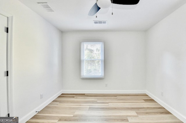 spare room with ceiling fan and light wood-type flooring