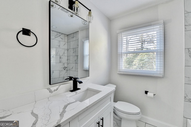 bathroom with vanity and toilet