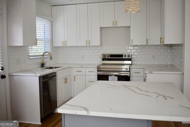 kitchen with pendant lighting, white cabinetry, electric range, a center island, and black dishwasher