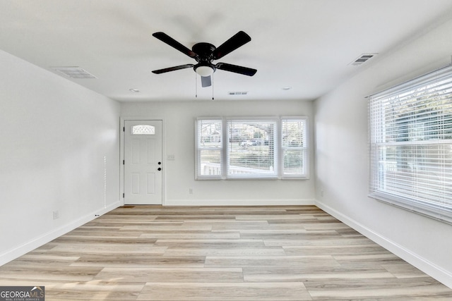 entrance foyer featuring ceiling fan, plenty of natural light, and light hardwood / wood-style floors