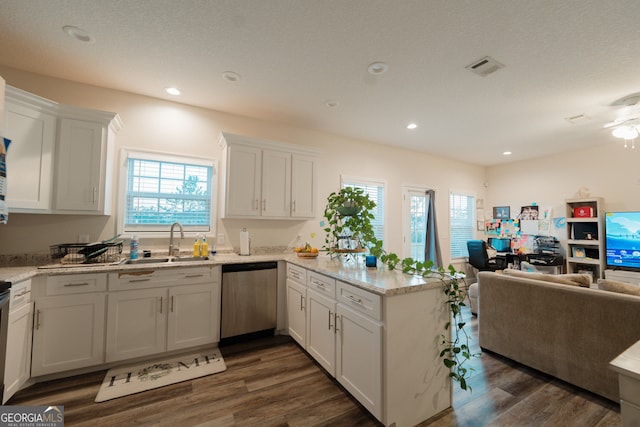 kitchen featuring white cabinetry, dishwasher, dark hardwood / wood-style floors, and sink