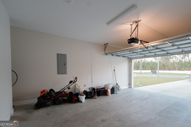 garage featuring electric panel and a garage door opener