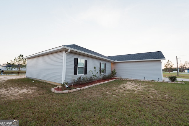 view of property exterior with a yard