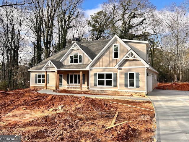 view of front of property featuring a porch and a garage