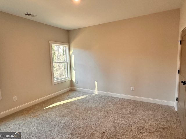 unfurnished room featuring carpet