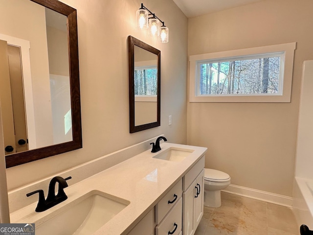 bathroom with vanity and toilet