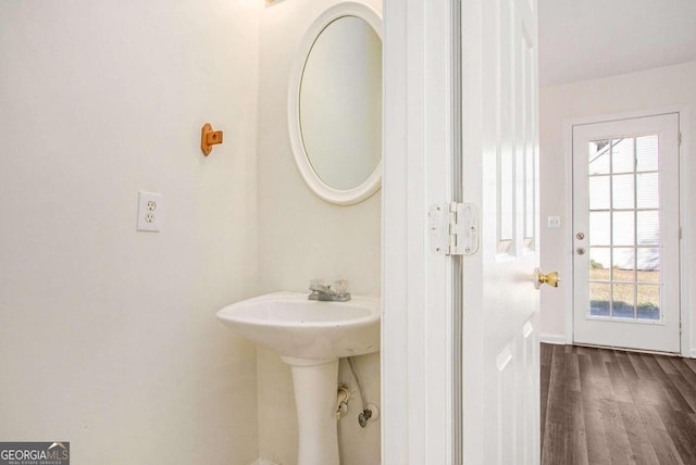 bathroom with hardwood / wood-style flooring