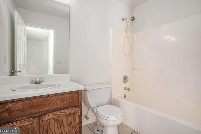 full bathroom with washtub / shower combination, vanity, tile patterned floors, and toilet