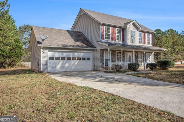 view of front facade with covered porch, a garage, and a front lawn