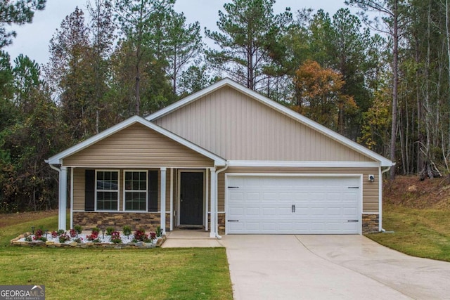 view of front of home with a garage and a front yard