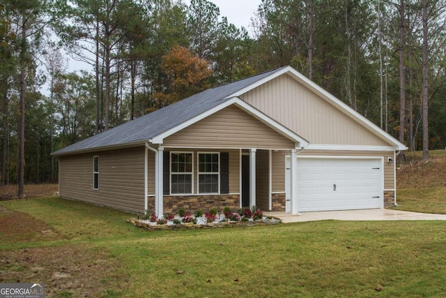 view of front of property with a porch, a garage, and a front lawn