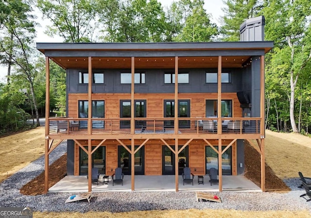 rear view of property with a patio area