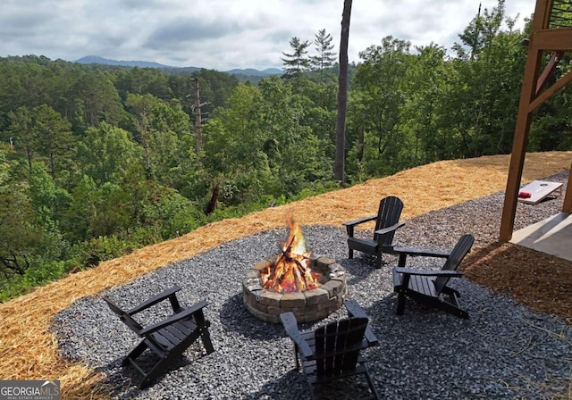 view of home's community featuring a fire pit