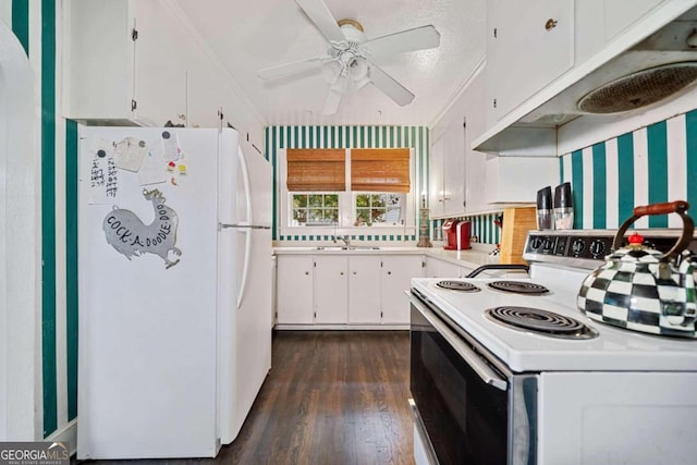 kitchen with dark hardwood / wood-style flooring, white appliances, a textured ceiling, sink, and white cabinets