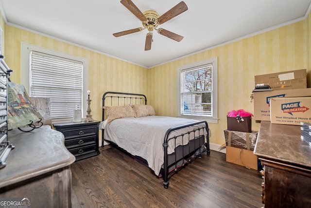 bedroom featuring dark wood-type flooring, ceiling fan, and crown molding