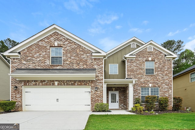 view of front of property featuring a front yard and a garage