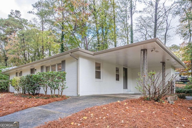 ranch-style house with a carport