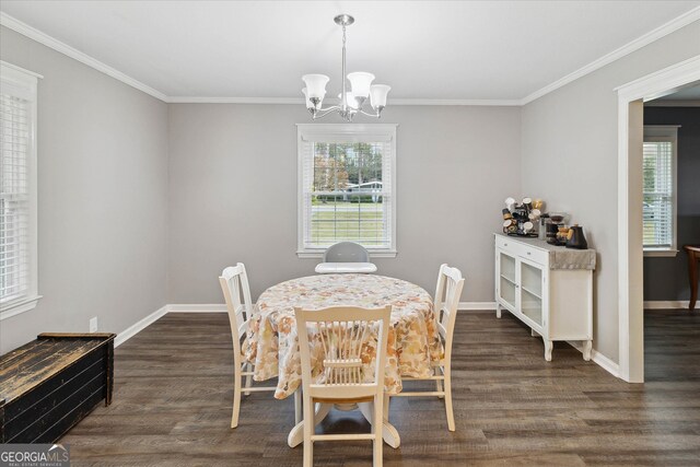 dining room featuring a chandelier, dark hardwood / wood-style flooring, and crown molding