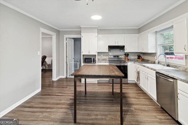 kitchen with white cabinets, dark hardwood / wood-style flooring, stainless steel appliances, and sink