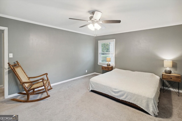 bedroom with ceiling fan, carpet floors, and ornamental molding