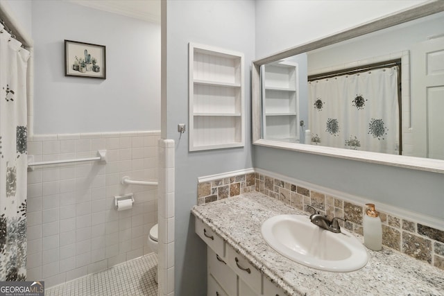 bathroom featuring vanity, toilet, and crown molding