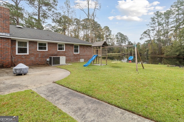 exterior space featuring a playground, a patio, and central AC