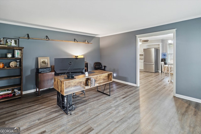 office area with hardwood / wood-style floors and ornamental molding