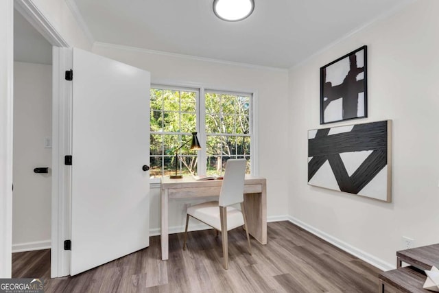 home office featuring hardwood / wood-style floors and ornamental molding