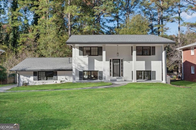 raised ranch featuring a front yard