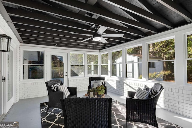 sunroom with vaulted ceiling, ceiling fan, and a healthy amount of sunlight