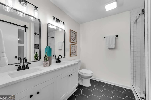 bathroom with tile patterned floors, toilet, vanity, and walk in shower