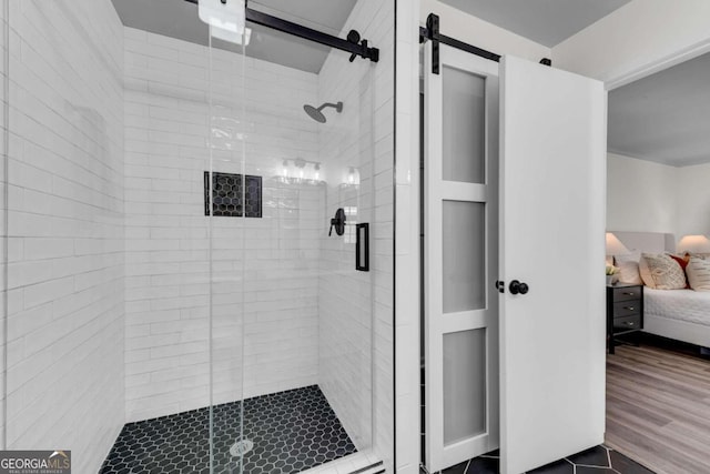 bathroom featuring wood-type flooring and walk in shower