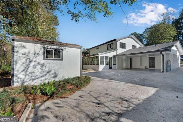 view of side of property with a sunroom