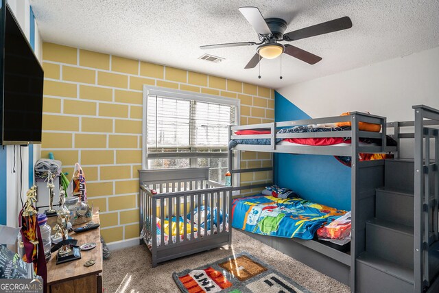 carpeted bedroom featuring a textured ceiling, vaulted ceiling, and ceiling fan