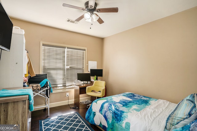 bedroom featuring ceiling fan and dark wood-type flooring