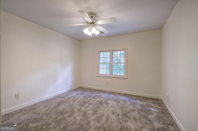 unfurnished room featuring carpet flooring and ceiling fan