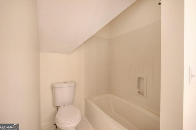 bathroom with tile patterned flooring and toilet