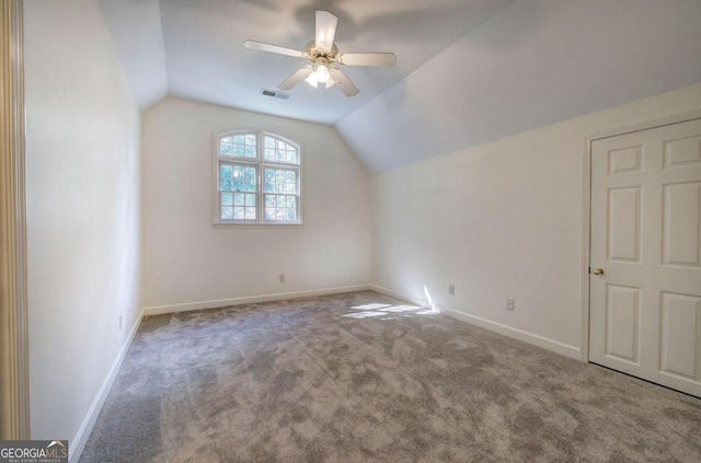 additional living space featuring ceiling fan, carpet floors, and vaulted ceiling