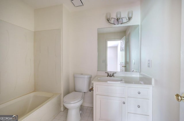 bathroom featuring toilet, vanity, and tile patterned floors