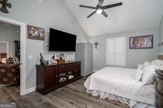 bedroom with ceiling fan, high vaulted ceiling, and dark wood-type flooring