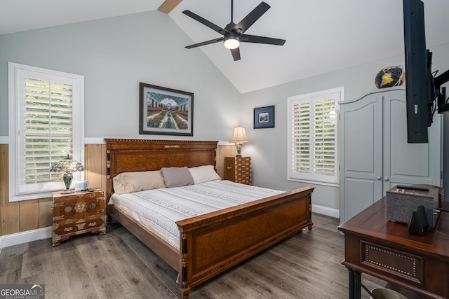 bedroom with wood-type flooring, ceiling fan, and lofted ceiling