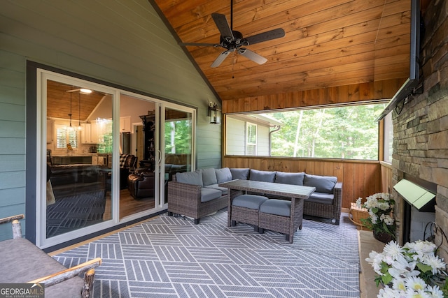 sunroom / solarium with ceiling fan, wood ceiling, and vaulted ceiling