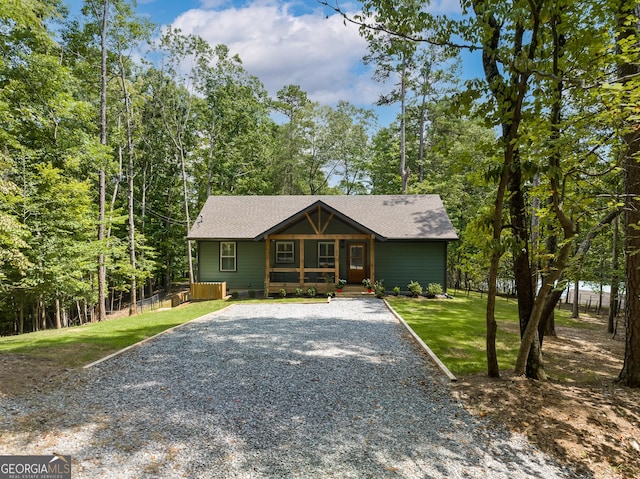 view of front of property featuring covered porch and a front lawn