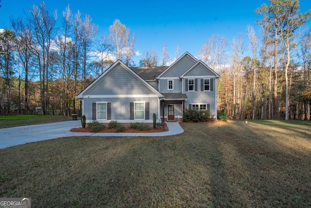 front facade featuring a front lawn and a garage