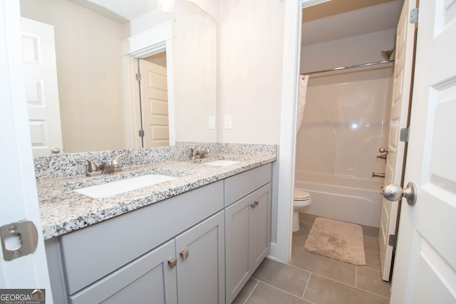 full bathroom featuring tile patterned floors, vanity, toilet, and shower / bathtub combination with curtain