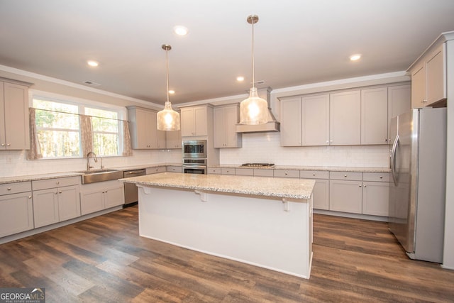 kitchen with appliances with stainless steel finishes, custom exhaust hood, dark wood-type flooring, sink, and a center island