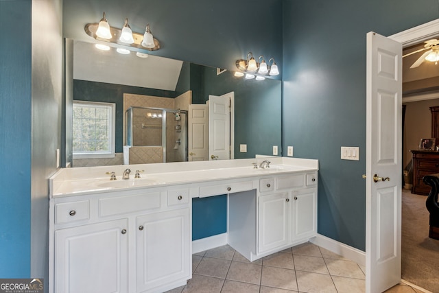 bathroom with tile patterned floors, ceiling fan, vanity, and an enclosed shower