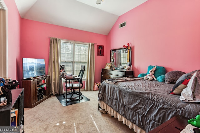 bedroom featuring light carpet and vaulted ceiling