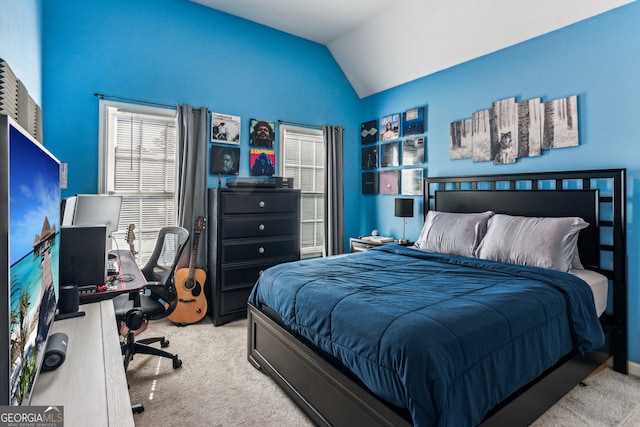 carpeted bedroom with vaulted ceiling